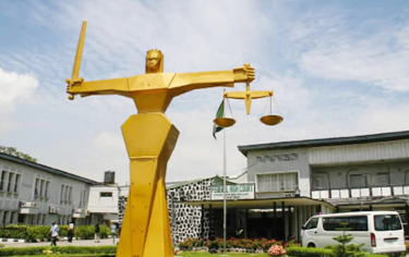 A court sentences a bank MD to five years in prison for fraud.