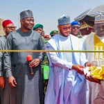 The defense minister praises Gov. Lawal for arming troops and providing them with surveillance drones.